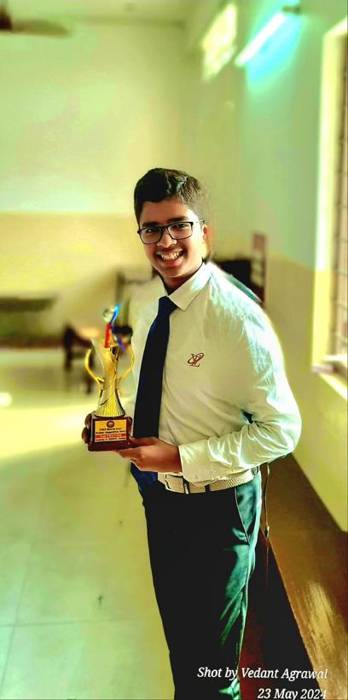 Vedant Agrawal holding the CISCE Meerut Zone debate trophy