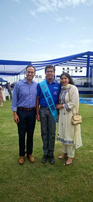 Vedant Agrawal with his parents at the Vice Head Boy investiture ceremony